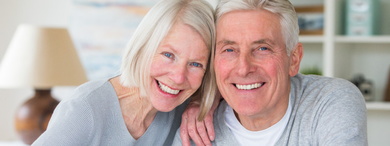 elderly woman and man smiling