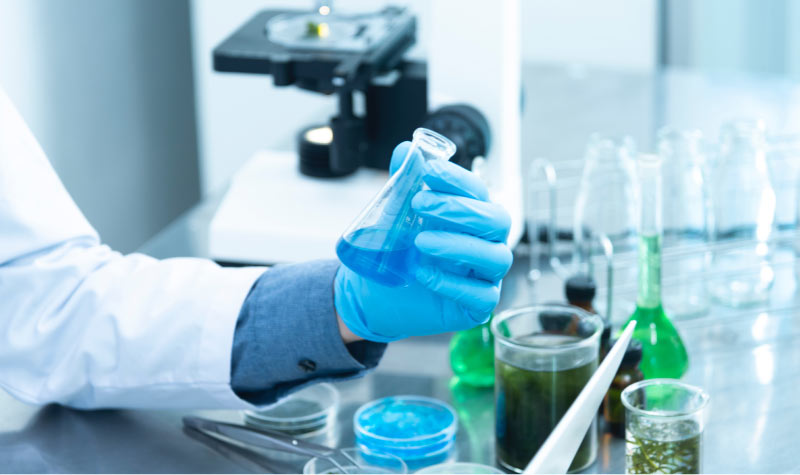 scientist in the lab testing tooth enamel gel