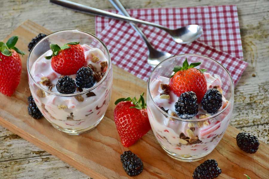 Pretty fruit parfaits in clear glass goblets.