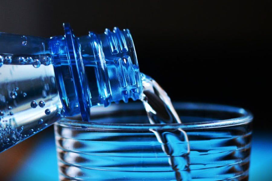 Water being poured into a glass.