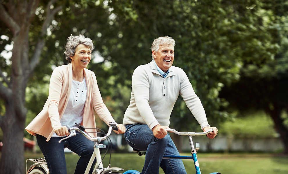 Cropped shot of a mature couple enjoying a bike ride in the park.